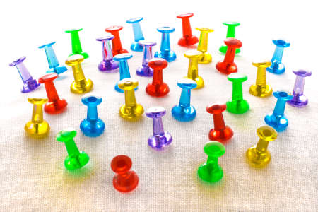 colorful pushpins on light background
