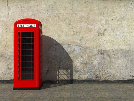 Classic red telephone booth at the dirty grunge wallの写真素材