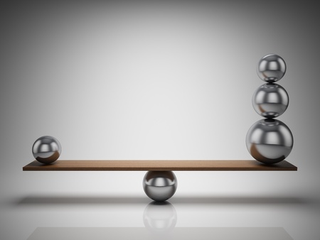 Balancing balls on wooden boardの写真素材