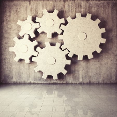 Large gear mechanism in room with concrete wallsの写真素材