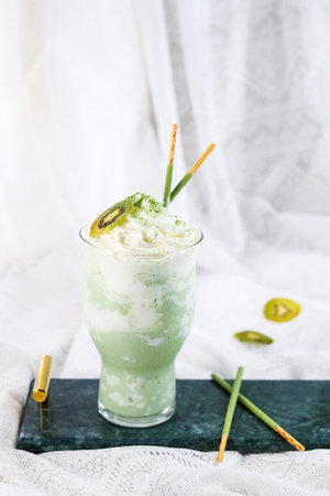 Green smoothie with kiwi in a glassの写真素材