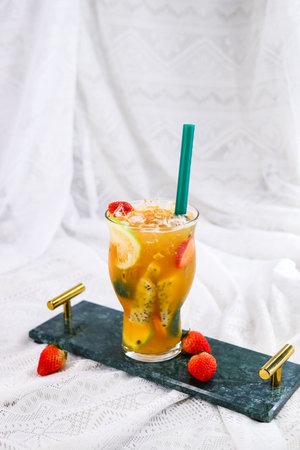 Passion fruit mojito cocktail with lime, mint and raspberriesの写真素材