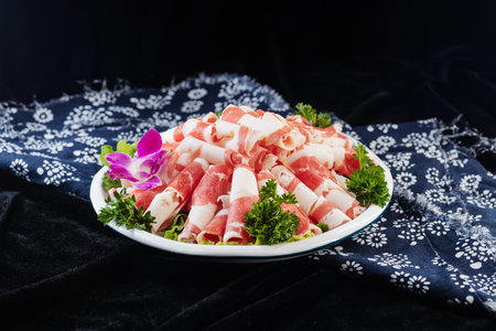slices of cold cuts on a white plateの写真素材