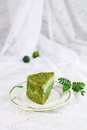 Green tea cake with cream on white background. Selective focus.の写真素材