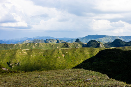 Mountain landscape with green meadows and blue sky, Taiwan.の写真素材