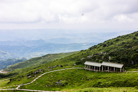 Mountain landscape with a pavilion on the top of the mountainの写真素材