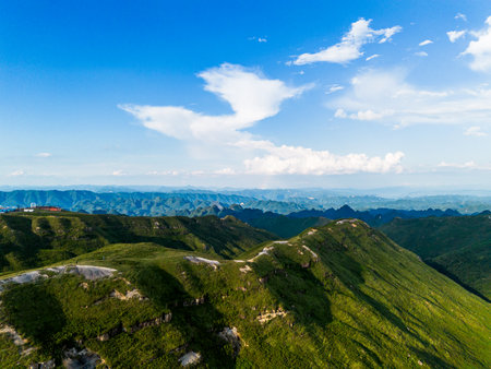 Aerial view of mountain and blue sky with white clouds. Nature landscape backgroundの写真素材