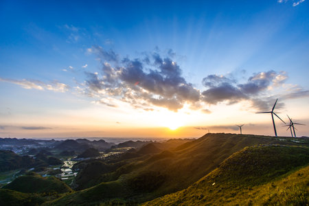 wind turbine on the hill with beautiful sunsetの写真素材