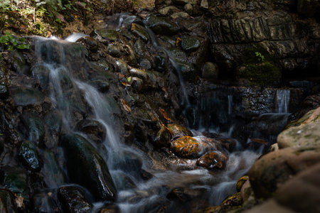 Waterfall in the forest. Beautiful waterfall in the forest. Mountain stream.の写真素材