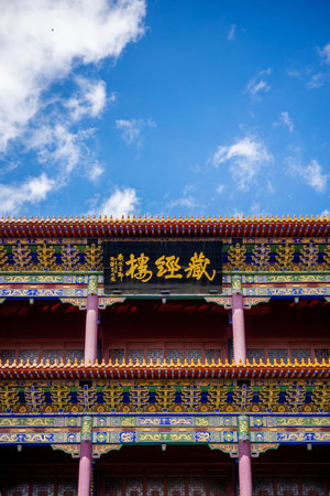 Chinese temple roof with blue sky background, closeup of photo.