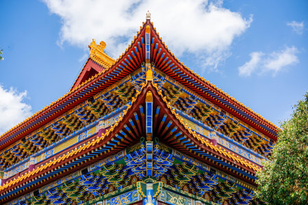 Thai style temple roof with blue sky background.の写真素材