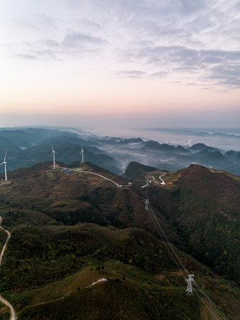 Aerial view of wind turbines in the mountains at sunrise, South Koreaの写真素材