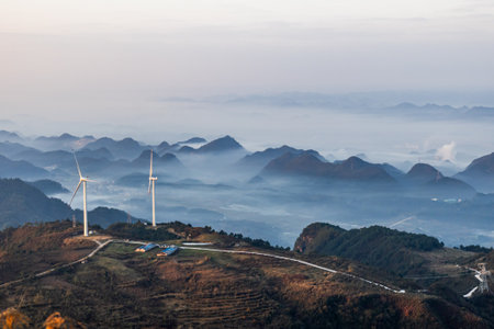 Wind turbines on the mountain in the morning at Doi Ang Khang, Chiang Mai, Thailandの写真素材