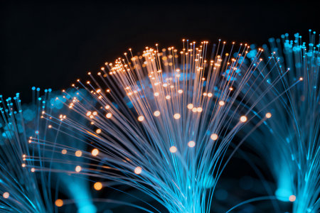 Fiber optical network cable close up. Blue fiber optic background.の素材