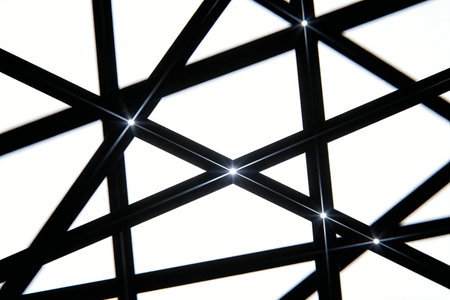 Abstract black and white image of a metal lattice with lights.の素材