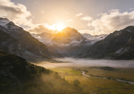 Mountain landscape with fog in the valley at sunrise, Switzerland.の素材