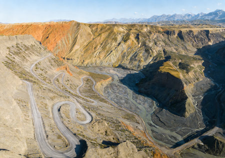 Mountain landscape with winding road in the colorful valley. View from above.の素材