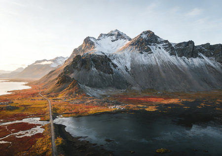 Aerial view of snow capped mountain peaks at sunset, Lofoten islands, Norwayの素材