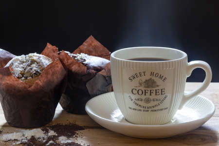 close up still life photo cup of coffee with muffinsの写真素材