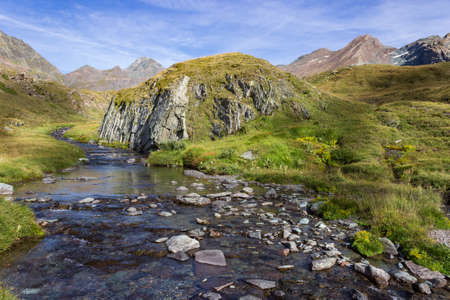 Hiking trail in Cogne valley, Aosta, Italy. Landscape of a wild mountain creek in the high walloon of Urtier.の写真素材