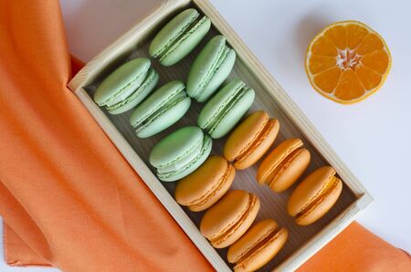 orange and green apple macaroonsの写真素材
