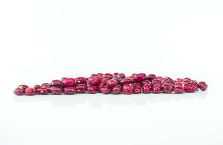 Nice red beans with brown spots on white background.