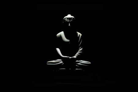 Buddha statue isolated on black backgroundの写真素材