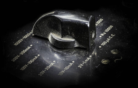 Macro-shot of a knob from a vintage analog electric meter