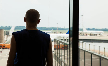 Silhouette of a man waiting at the airportの写真素材