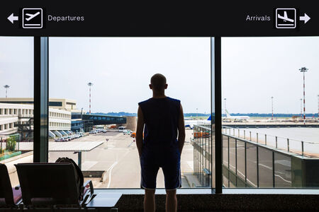Silhouette of a man waiting at the airportの写真素材