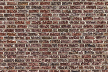 Texture of a typical wall with red bricksの写真素材