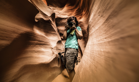 A photographer in the Lower Antelope Canyon (Arizona)の写真素材