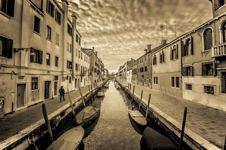 Canal in Venice in a cloudy dayの写真素材