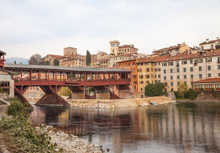 Bridge Ponte degli Alpini at river Brenta in Bassano del Grappa, Italy. Panoramic view at old town with vintage building and wooden bridge
のeditorial素材