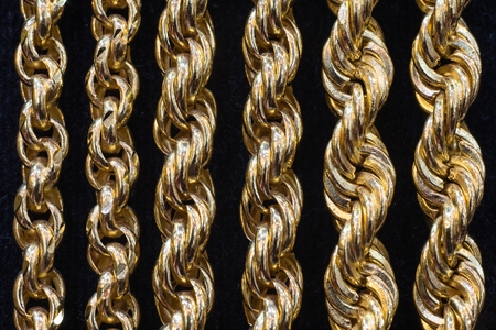 Gold chain necklace with black backgroundの写真素材