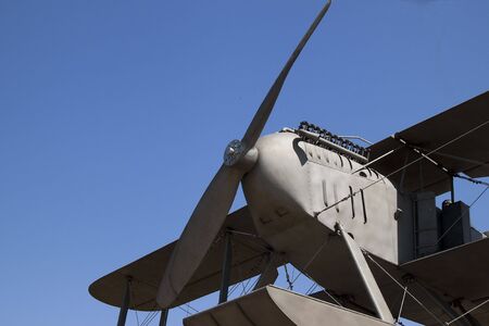Old airplane from ware in the blue sky
