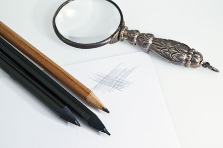 old lens and pencils の写真素材