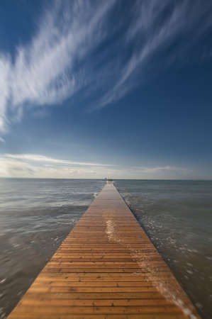 Long Wood Pier on Mediterranean Seaの写真素材