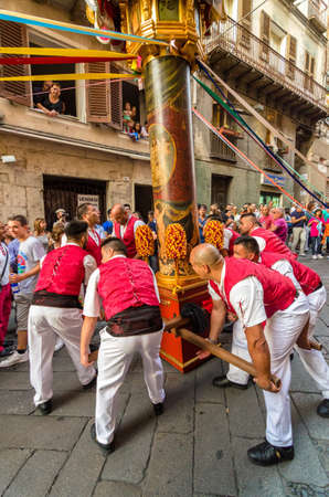 Traditional religious procession which takes place every August 14th in the city of Sassari (Sardinia), during which 10 wooden columns with the weight of 400Kg each are carried on shoulder through the city.のeditorial素材