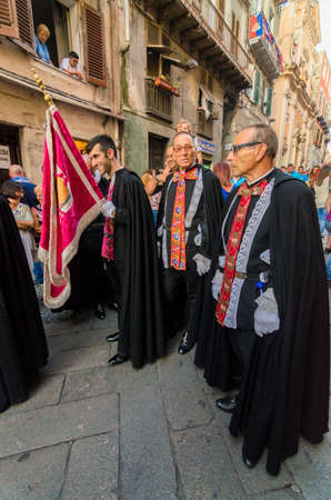Traditional religious procession which takes place every August 14th in the city of Sassari (Sardinia), during which 10 wooden columns with the weight of 400Kg each are carried on shoulder through the city.のeditorial素材
