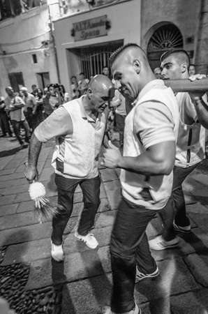Traditional religious procession which takes place every August 14th in the city of Sassari (Sardinia), during which 10 wooden columns with the weight of 400Kg each are carried on shoulder through the city.のeditorial素材