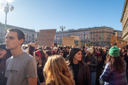 November 25, 2023 - Milan - the procession of the demonstration against violence against women flows through Piazza Duomoのeditorial素材