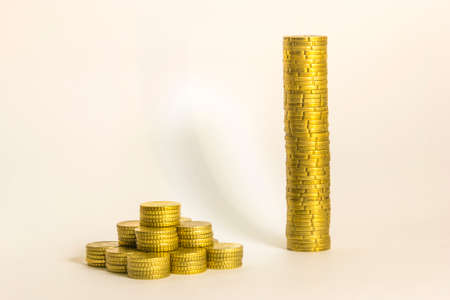 Yellow coins in different layout with white backgroundの写真素材