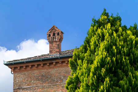 Chimney on the rooftop of a brick house