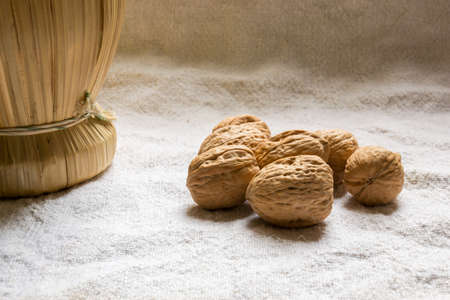 Set with some walnuts and a wine bottleの写真素材