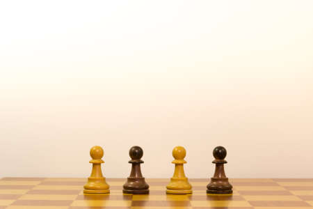 Concept of different ethnicity with pawns of chessの写真素材