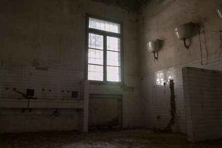 Interiors of an abandoned madhouse in the downtownの写真素材