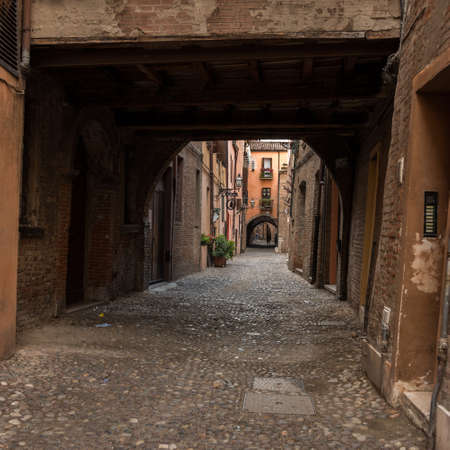 Ancient medieval street in the downtown of Ferrara cityの写真素材