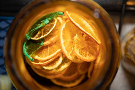 dried orange and lemon for cocktail in jarの写真素材