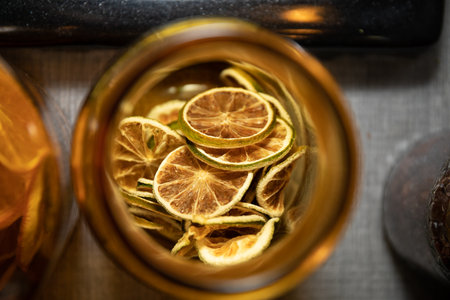 dried orange and lemon for cocktail in jarの写真素材